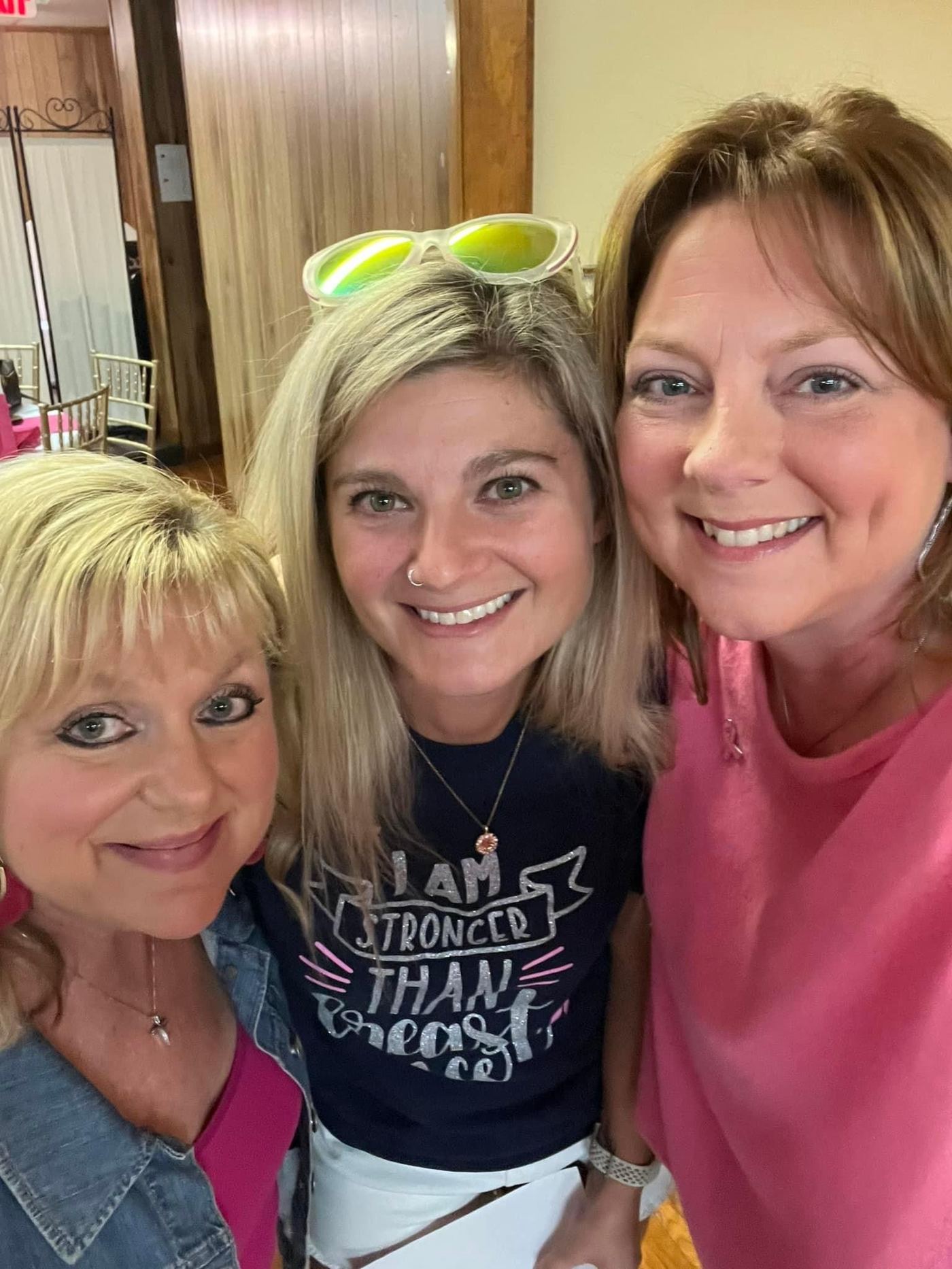 Three guests smiling together